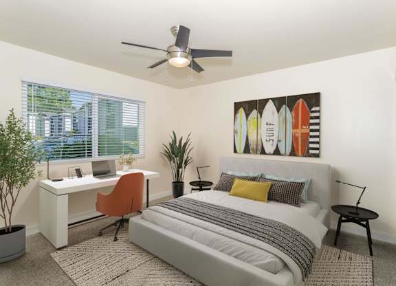 Student bedroom with bed and dedicated desk space at Gateway Apartments in Chico, CA