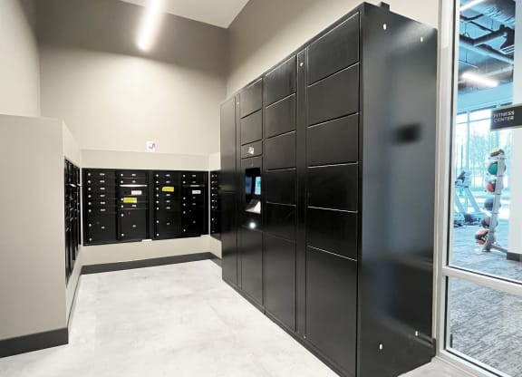 a bunch of lockers in a room with a window at The Duo, University Place, WA 