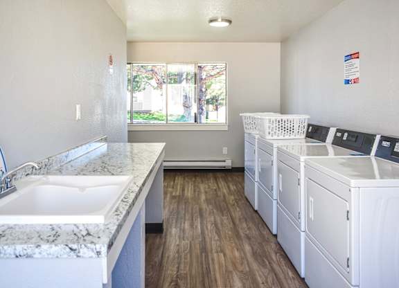 Community laundry room with washer and dryers at Kirkwood Meadows in Pocatello, ID