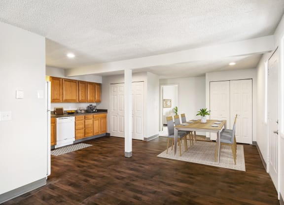 An open dining room and kitchen with a pantry to the left and a double-door closet to the right. Access to the hallway and bedrooms are behind.at Wildflower, Kennewick, WA
