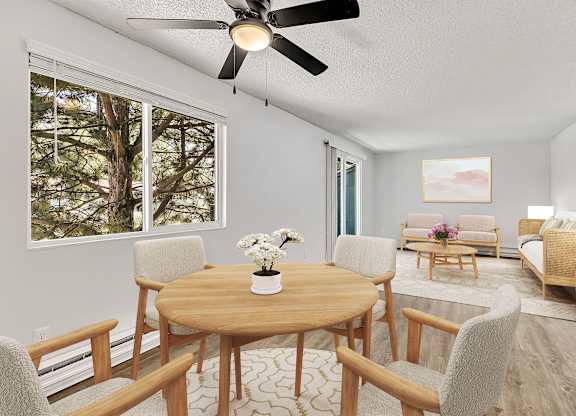 A living room with a wooden table and chairs.