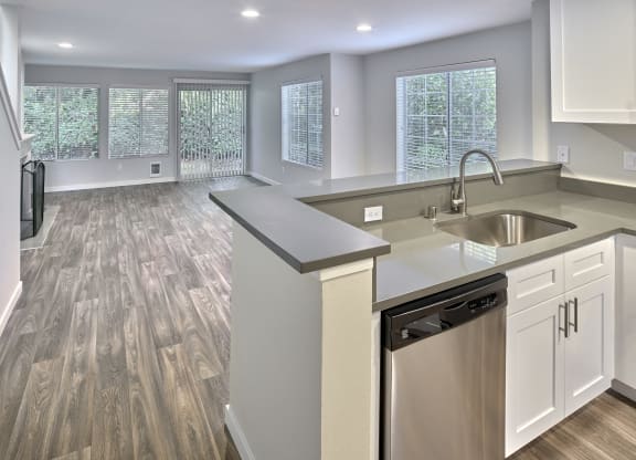 an empty kitchen and living room with a sink and dishwasher at Edmonds Gateway, Washington, 98026