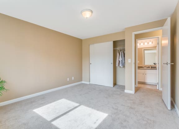 an empty living room with a closet and a bathroom at Springfield, Washington, 98055