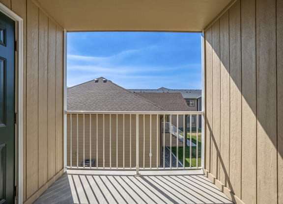 a balcony with a view of a house