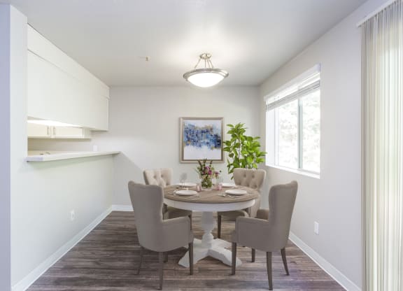 a dining room with a table and chairs
