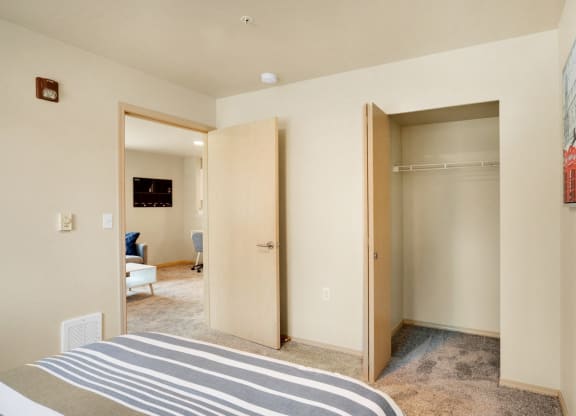 a bedroom with two closets and a bed and a carpeted floor at Sky Vue, Bellingham Washington