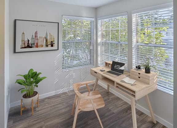 Room stage with office furniture. Three large windows let in a lot of natural light. Area has hard wood style flooring.at Edmonds Gateway, Edmonds, WA
