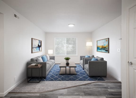 a living room with white walls and a blue rug