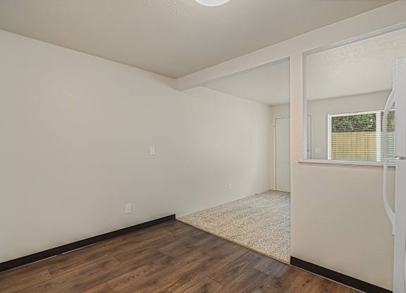 Open dining area and kitchen layout in a 1 bed 1 bath apartment at The Lakes Apartments in Moses Lake WA