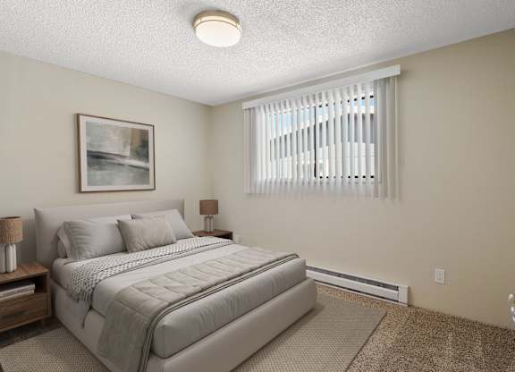 Carpeted bedroom with queen bed and large window with blinds for natural light at the Lakes Apartments in Moses Lake