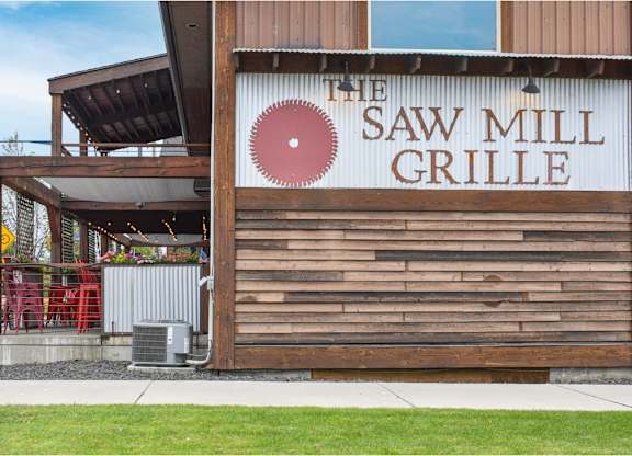 The Saw Mill Grille is a restaurant with a wooden exterior.
