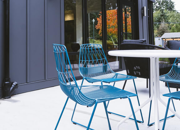 Outdoor lounge with seating area and access to the clubhouse at University Glen, Washington