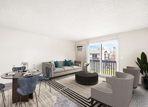Living and dining area, sunny glass sliding doors with a view of grass lawn. Staged with a couch, 2 chairs, table, dining set and a plant.at Wildflower, Kennewick, 99336