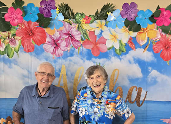 A man and a woman are standing at Lodi Commons Senior Living, California