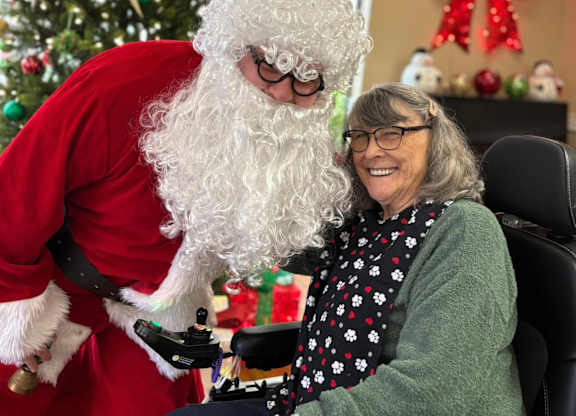 A person in a Santa costume at Lodi Commons Senior Living, Lodi, 95240