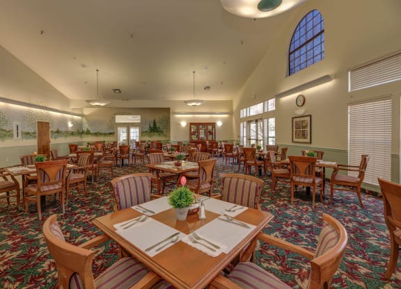 a large dining room with tables and chairs at Hilltop Commons Senior Living, Grass Valley California