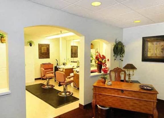 a living room and a dining room with a table and chairs at River Commons Senior Living, Redding, CA 96002