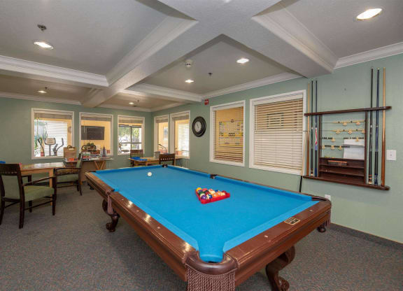 Game room with billiards table at Campus Commons Senior Living, Sacramento 