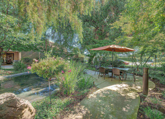 Outdoor courtyard with water feature at Campus Commons Senior Living, Sacramento, 95825