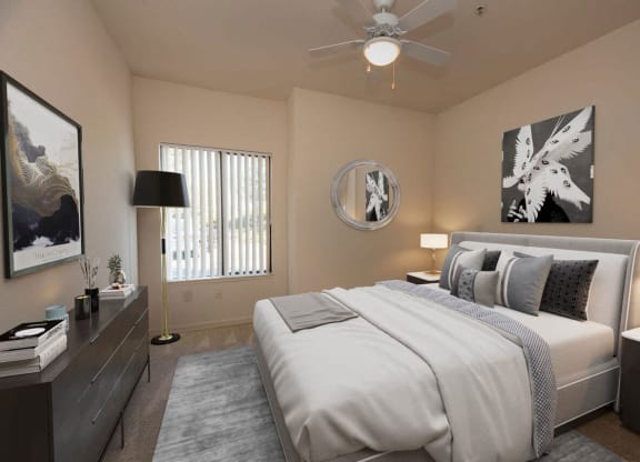 a bedroom with a bed and a ceiling fan at Winding Commons Senior Living, Carmichael, CA