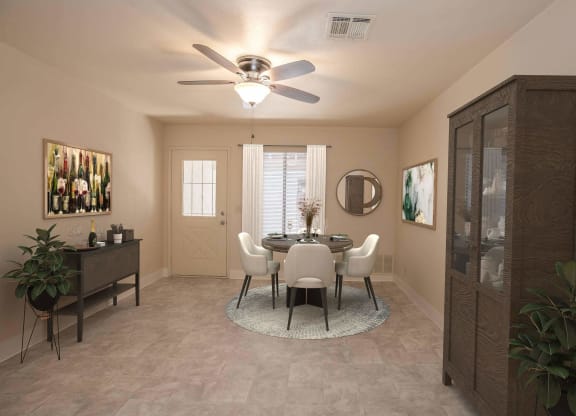 a dining room with a ceiling fan and a table and chairs at Castle Vista Senior Duplex Community, Atwater, CA