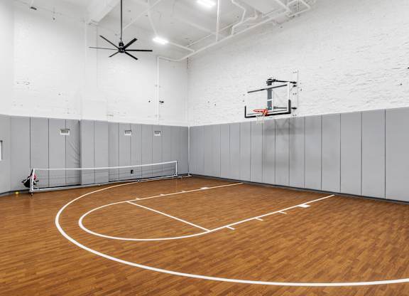 the gym has a hardwood floor and a basketball hoop at Textile Apartments, Ohio, 45202