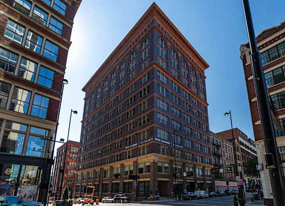a tall brick building on a city street at Textile Apartments, Cincinnati, OH, 45202