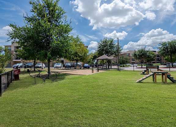 a park with a picnic area and a playground at Discovery at Craig Ranch, Texas
