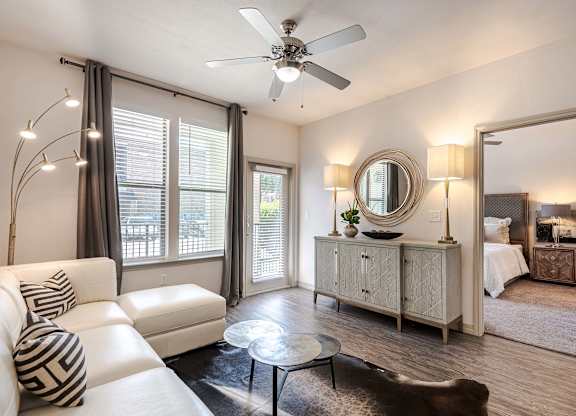 a living room with a couch and a ceiling fan at Discovery at Craig Ranch, McKinney, TX, 75070