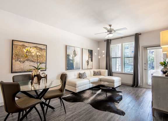 a living room with a couch and a table at Discovery at Craig Ranch, Texas, 75070