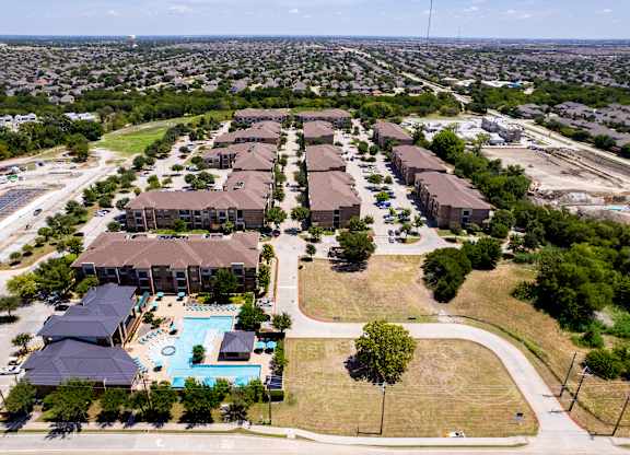 an aerial view of a neighborhood with houses and a swimming pool at Discovery at Craig Ranch, McKinney, TX