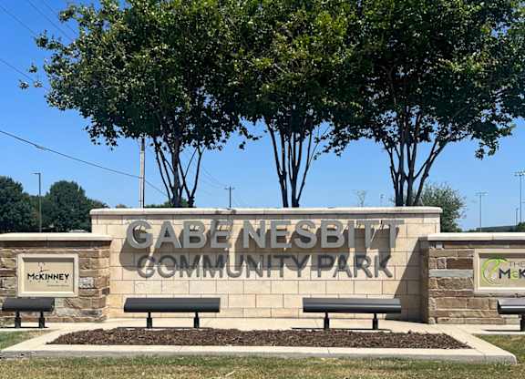 The sign in front of the trees says Cabernet Community Park at Discovery at Craig Ranch, McKinney, 75070.