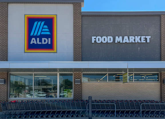 An ALDI food market storefront with shopping carts in front at Discovery at Craig Ranch, McKinney, 75070