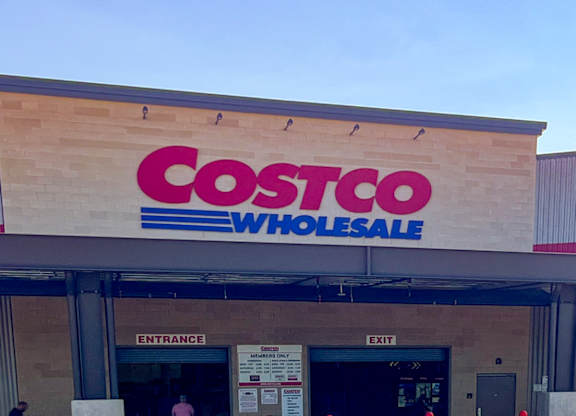 The Costco Wholesale logo is displayed on a building at Craig Ranch, McKinney, TX.
