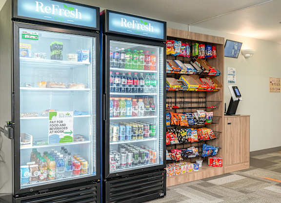 A vending machine with a glass door and a sign that says