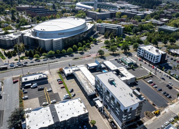 an aerial view of a city with buildings and a stadium