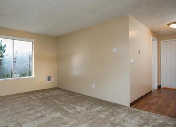A room with a window and a door.