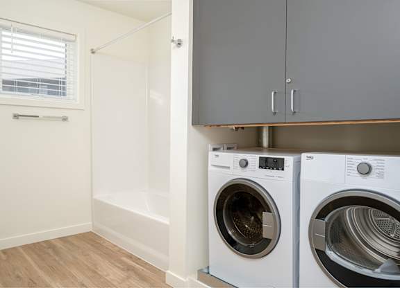 A laundry room with a washer and dryer.