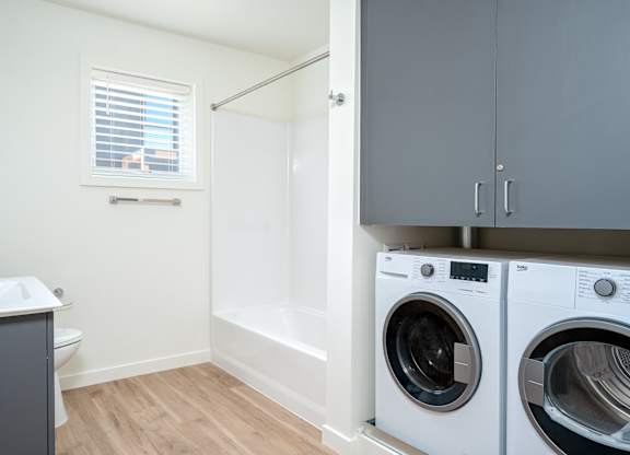 A laundry room with a washer and dryer.