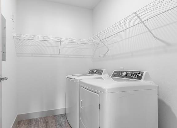 A laundry room with a washer and dryer.