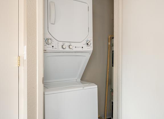stackable washer and dryer in a closet