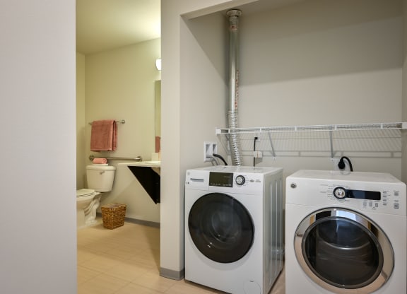full size washer and dryer in one bedroom at The Waterline