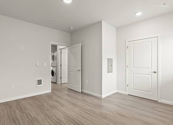 A room with a washer and dryer in it.