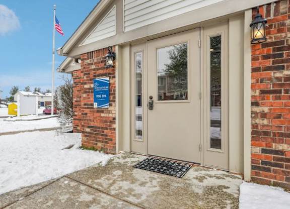 The entrance to a building with a sign that reads "100" on it.