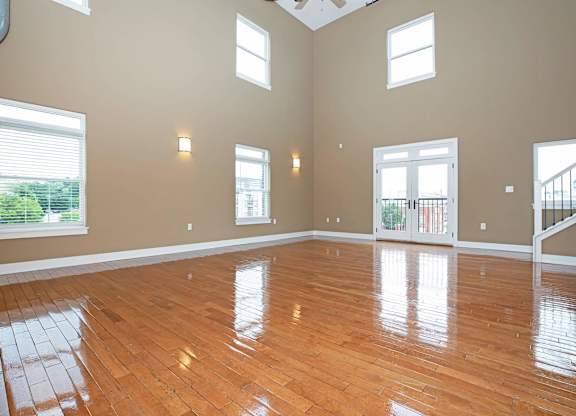 A room with wooden floors and a skylight.