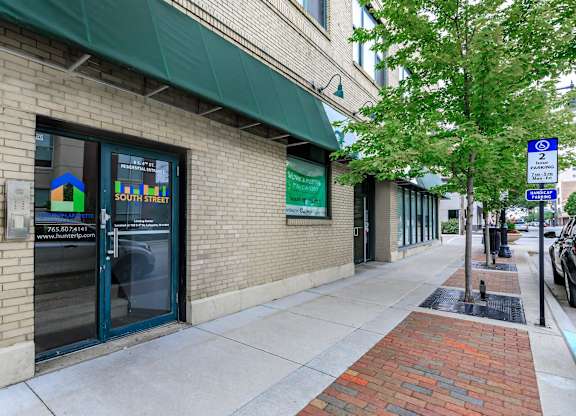 A building with a green awning on South Street.