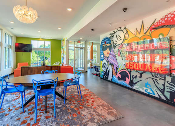 A brightly colored mural with the word "Inspire" written on it.