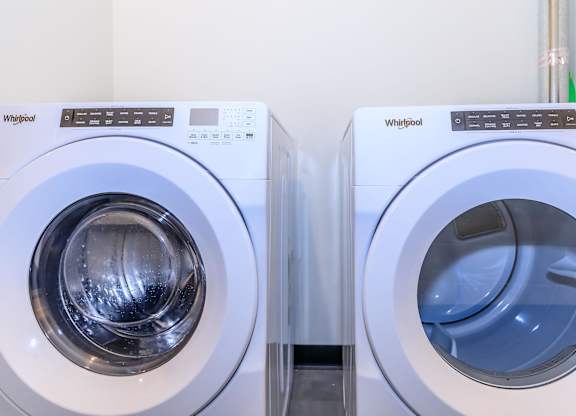 Two Whirlpool washing machines side by side.