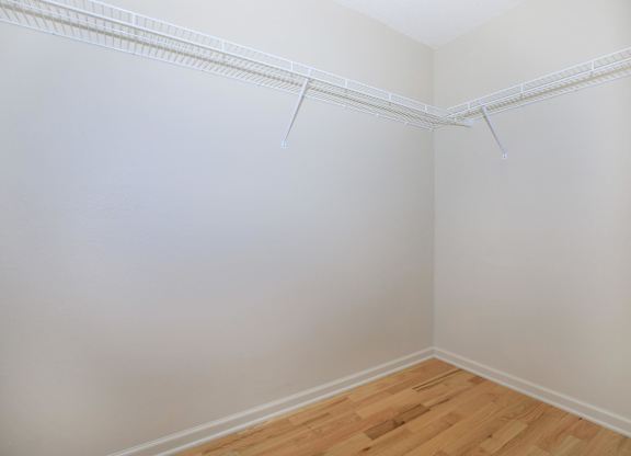 A room with white walls and wooden flooring.