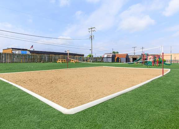 A baseball field with a sand pit in the middle.
